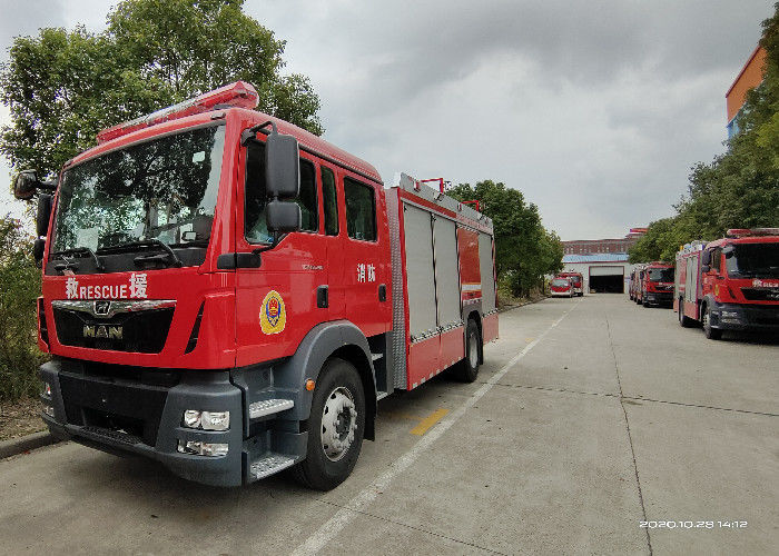 MAN Large Space Cab Foam and Water Tanker Fire Truck close by Shutter Doors